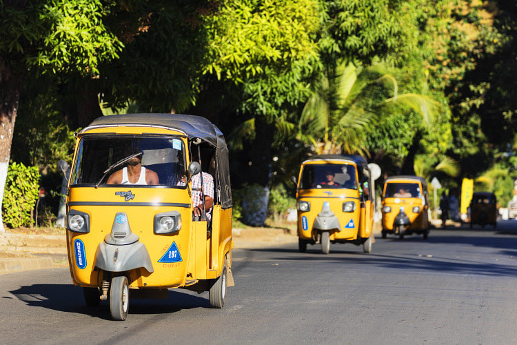 tuk tuk travelling on the roads of Nosy Be in Madagascar